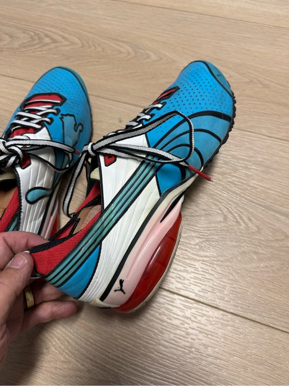 Puma Toori Run C, bold anime-inspired pop-art blue, white and red colorway 9.5